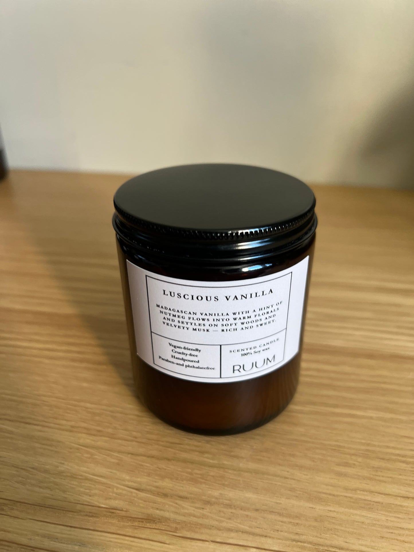 Jar of luxurious vanilla on a wooden surface